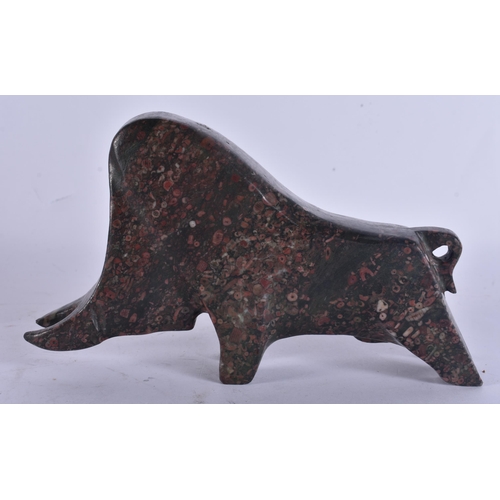 271 - A STYLISH PUDDINGSTONE CARVED ABSTRACT FIGURE OF A BULL. 17 cm wide.