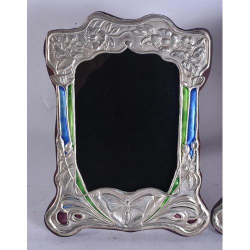 286 - A PAIR OF SILVER AND ENAMEL PHOTOGRAPH FRAMES. 18 cm x 18 cm.