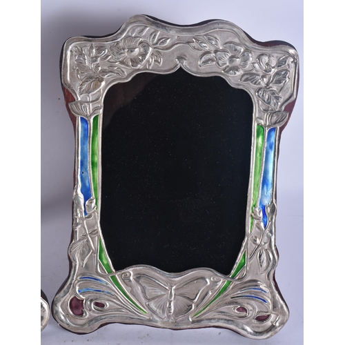 286 - A PAIR OF SILVER AND ENAMEL PHOTOGRAPH FRAMES. 18 cm x 18 cm.