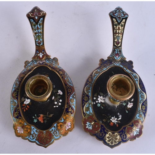 297 - AN UNUSUAL PAIR OF ANTIQUE PIETRA DURA CHAMPLEVE ENAMEL CHAMBERSTICKS. 21 cm wide.