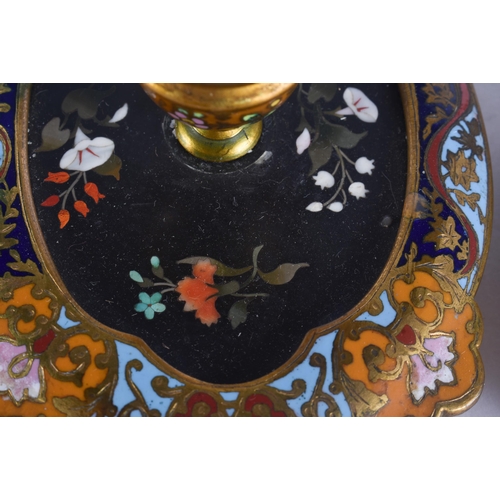 297 - AN UNUSUAL PAIR OF ANTIQUE PIETRA DURA CHAMPLEVE ENAMEL CHAMBERSTICKS. 21 cm wide.