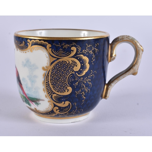 128 - AN EXTREMELY RARE 18TH CENTURY FRENCH VINCENNES PORCELAIN CUP AND SAUCER painted with blue scale bir... 