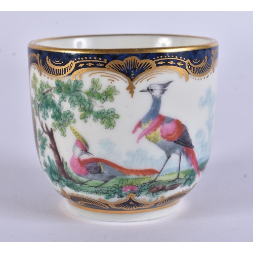 128 - AN EXTREMELY RARE 18TH CENTURY FRENCH VINCENNES PORCELAIN CUP AND SAUCER painted with blue scale bir... 