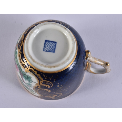 128 - AN EXTREMELY RARE 18TH CENTURY FRENCH VINCENNES PORCELAIN CUP AND SAUCER painted with blue scale bir... 