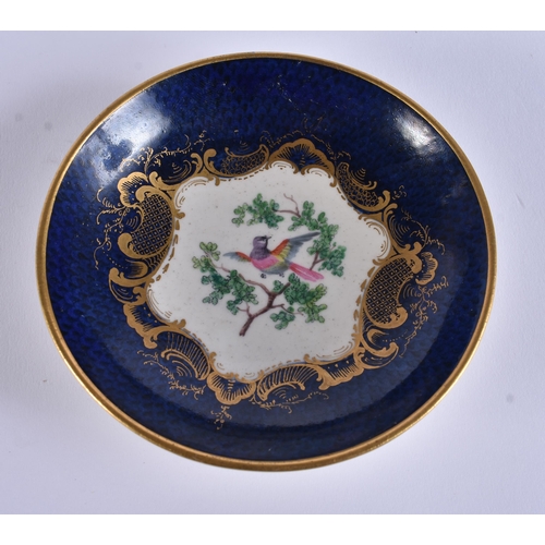 128 - AN EXTREMELY RARE 18TH CENTURY FRENCH VINCENNES PORCELAIN CUP AND SAUCER painted with blue scale bir... 