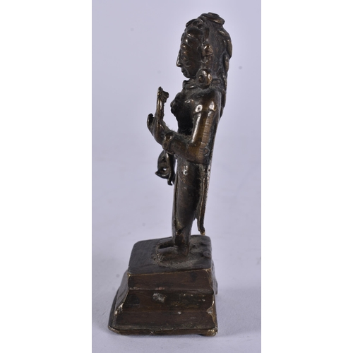 14 - AN 18TH CENTURY INDIAN BRONZE FIGURE OF A DEITY modelled upon a stepped base. 12.5 cm high.