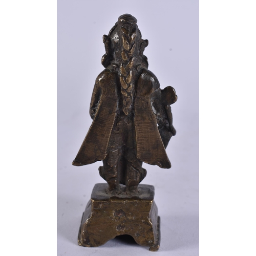 14 - AN 18TH CENTURY INDIAN BRONZE FIGURE OF A DEITY modelled upon a stepped base. 12.5 cm high.