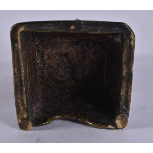 14 - AN 18TH CENTURY INDIAN BRONZE FIGURE OF A DEITY modelled upon a stepped base. 12.5 cm high.