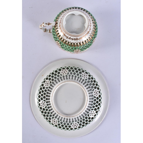 152 - A LOVELY 19TH CENTURY WORCESTER RETICULATED CUP AND SAUCER painted with flowers. 13 cm wide. (2)