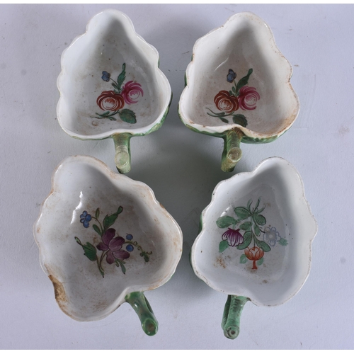 16 - A SET OF FOUR 18TH CENTURY ITALIAN PORCELAIN LEAF SHAPED DISHES painted with flowers. 9 cm wide. (4)