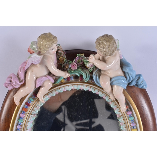 43 - AN ANTIQUE MEISSEN PORCELAIN ENCRUSTED CUP together with a mirror. Largest 28 cm x 18 cm. (2)