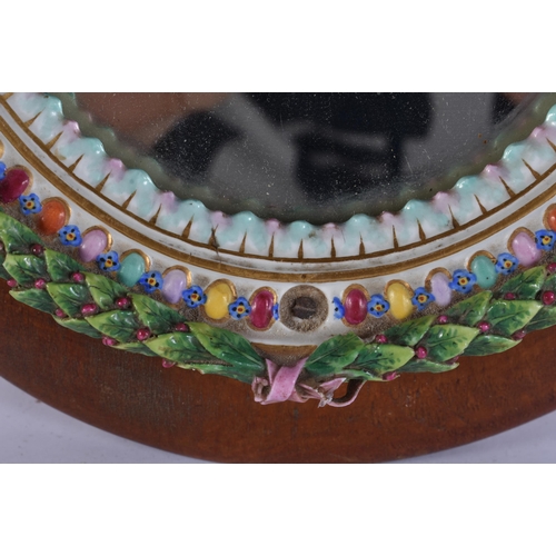 43 - AN ANTIQUE MEISSEN PORCELAIN ENCRUSTED CUP together with a mirror. Largest 28 cm x 18 cm. (2)