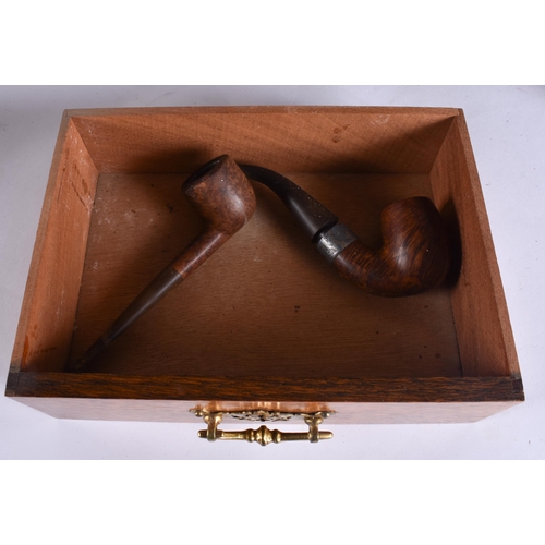 47 - A LATE VICTORIAN/EDWARDIAN OAK SMOKERS CABINET containing pipes and matchbox cases, together with a ... 