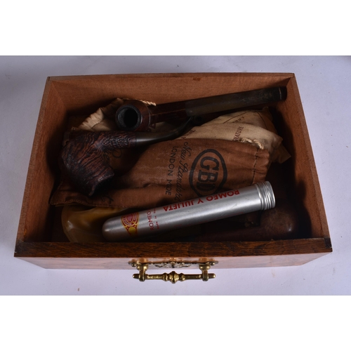 47 - A LATE VICTORIAN/EDWARDIAN OAK SMOKERS CABINET containing pipes and matchbox cases, together with a ... 