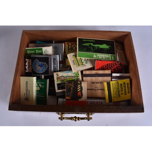 47 - A LATE VICTORIAN/EDWARDIAN OAK SMOKERS CABINET containing pipes and matchbox cases, together with a ... 