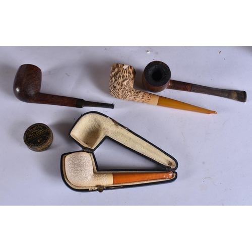 47 - A LATE VICTORIAN/EDWARDIAN OAK SMOKERS CABINET containing pipes and matchbox cases, together with a ... 