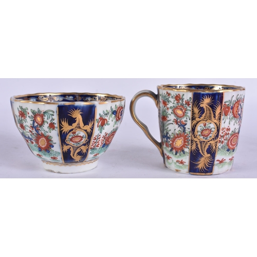 54 - AN EARLY 19TH CENTURY CHAMBERLAINS WORCESTER TRIO painted with flowers on a blue scale ground. 12.5 ... 