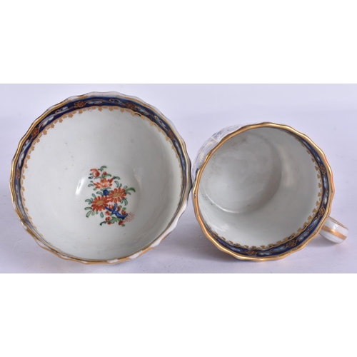 54 - AN EARLY 19TH CENTURY CHAMBERLAINS WORCESTER TRIO painted with flowers on a blue scale ground. 12.5 ... 