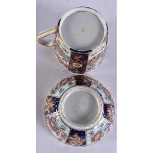 54 - AN EARLY 19TH CENTURY CHAMBERLAINS WORCESTER TRIO painted with flowers on a blue scale ground. 12.5 ... 