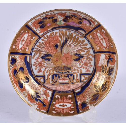 56 - AN EARLY 19TH CENTURY CHAMBERLAINS WORCESTER TRIO painted with imari gardens. 12 cm wide. (3)