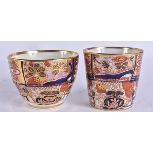 56 - AN EARLY 19TH CENTURY CHAMBERLAINS WORCESTER TRIO painted with imari gardens. 12 cm wide. (3)