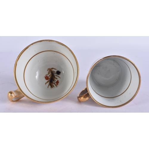 56 - AN EARLY 19TH CENTURY CHAMBERLAINS WORCESTER TRIO painted with imari gardens. 12 cm wide. (3)
