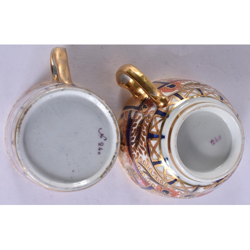 56 - AN EARLY 19TH CENTURY CHAMBERLAINS WORCESTER TRIO painted with imari gardens. 12 cm wide. (3)
