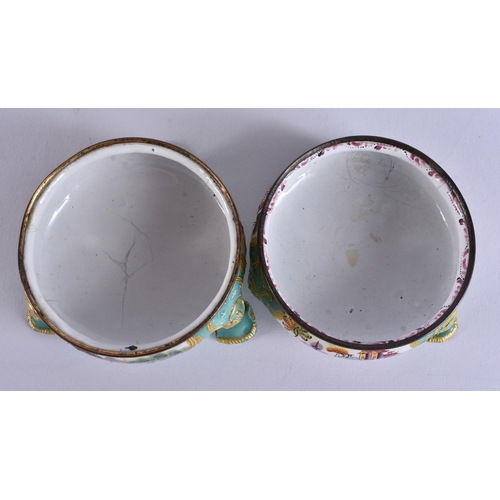 5 - AN UNUSUAL PAIR OF 18TH CENTURY BATTERSEA ENAMEL SALTS painted with landscapes. 7 cm wide.