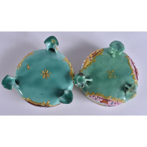 5 - AN UNUSUAL PAIR OF 18TH CENTURY BATTERSEA ENAMEL SALTS painted with landscapes. 7 cm wide.