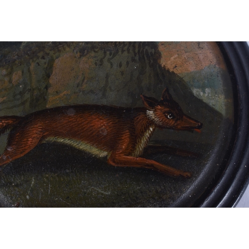 8 - AN EARLY VICTORIAN SNUFF BOX painted with a fable scene of a roaming fox. 8.5 cm wide.
