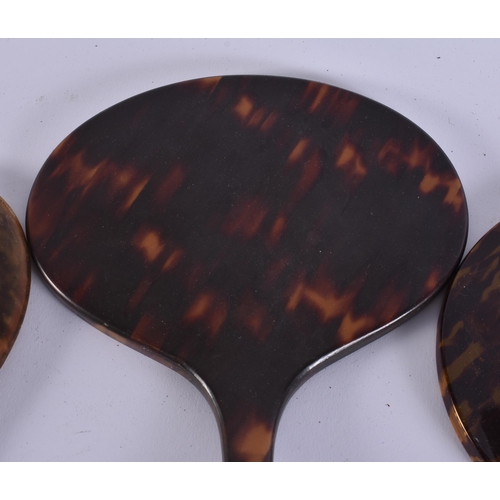 11 - FIVE VINTAGE FAUX TORTOISESHELL VANITY MIRRORS. 34 cm long. (5)