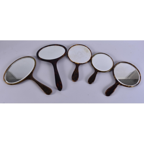 11 - FIVE VINTAGE FAUX TORTOISESHELL VANITY MIRRORS. 34 cm long. (5)