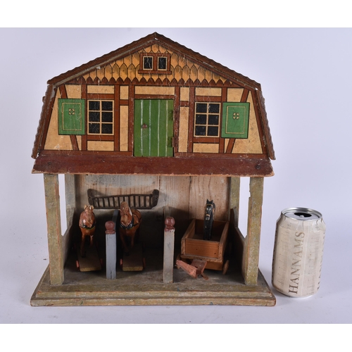 111 - AN UNUSUAL ANTIQUE FOLK ART PAINTED WOOD HORSE STABLES with horses and cart. 40 cm x 25 cm.