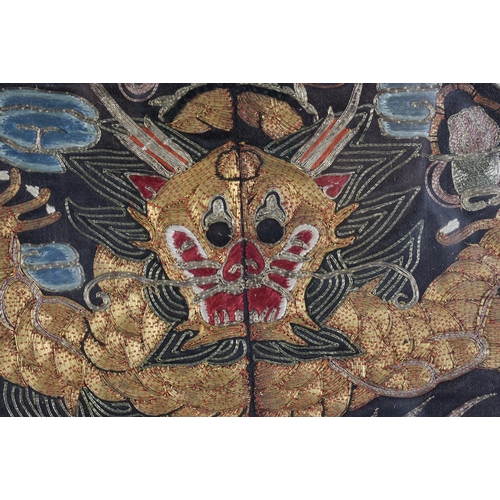 116 - A CHINESE QING DYNASTY SILK EMBROIDERED DRAGON RANK BADGE. 31.5 cm wide.
