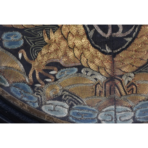 116 - A CHINESE QING DYNASTY SILK EMBROIDERED DRAGON RANK BADGE. 31.5 cm wide.