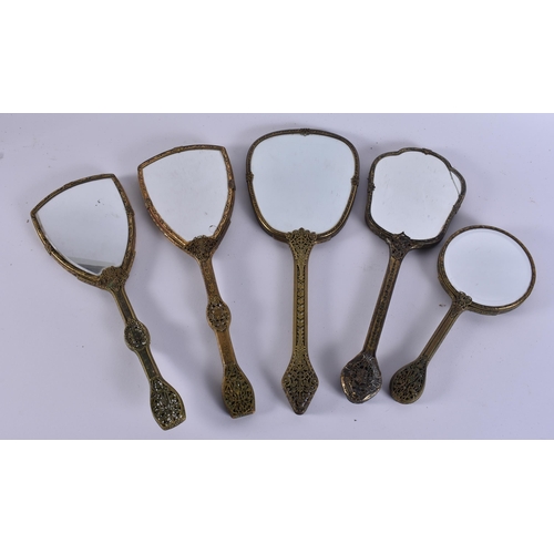 12 - FIVE VINTAGE EMBROIDERED GILT METAL VANITY MIRRORS. 38 cm long. (5)