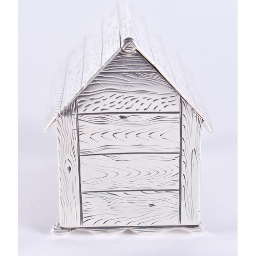 120C - AN EARLY 20TH CENTURY SILVER NOVELTY DOG KENNEL VESTA CASE modelled as a kennel with pitched roof en... 