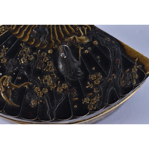155 - A 19TH CENTURY JAPANESE MEIJI PERIOD BRONZE GOLD ONLAID FAN SHAPED BOX decorated with birds amongst ... 