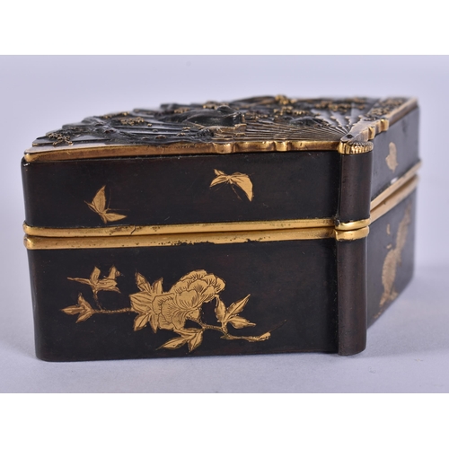 155 - A 19TH CENTURY JAPANESE MEIJI PERIOD BRONZE GOLD ONLAID FAN SHAPED BOX decorated with birds amongst ... 