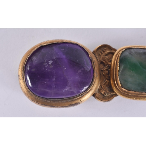 170 - AN 18TH/19TH CENTURY CHINESE BRONZE JADEITE, AMETHYST AND SMOKEY QUARTZ BELT BUCKLE. 9 cm wide.