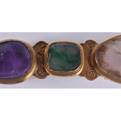 170 - AN 18TH/19TH CENTURY CHINESE BRONZE JADEITE, AMETHYST AND SMOKEY QUARTZ BELT BUCKLE. 9 cm wide.