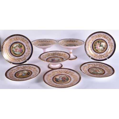 180A - A SUITE OF EARLY 20TH CENTURY AUSTRIAN VIENNA PORCELAIN DESSERT WARES painted with figures in variou... 