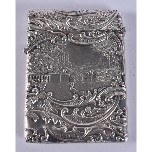 197 - AN ANTIQUE SILVER REPOUSSE MUSICIAN CARD CASE. 73 grams. 10.5 cm x 7.5 cm.