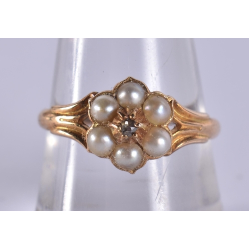 199 - AN 18CT GOLD PEARL AND DIAMOND RING. 2.4 grams.