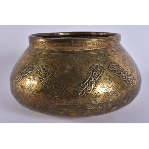 20 - A 19TH CENTURY ISLAMIC MIDDLE EASTERN BRASS CENSER decorated with Kufic script. 18 cm wide.
