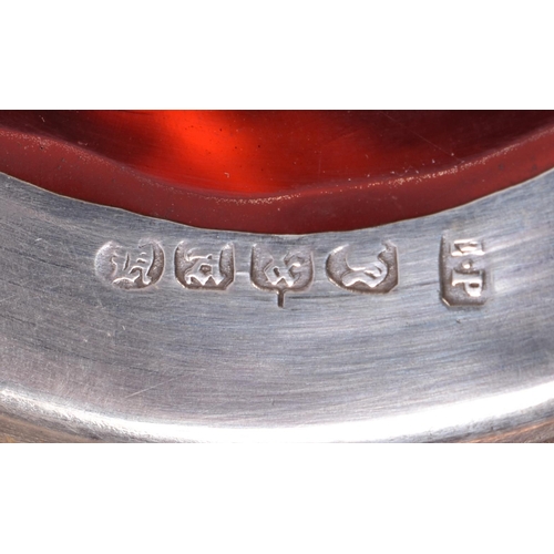 200E - AN ANTIQUE SILVER MOUNTED LEATHER TANKARD together with a smaller silver plated ruby glass tankard. ... 