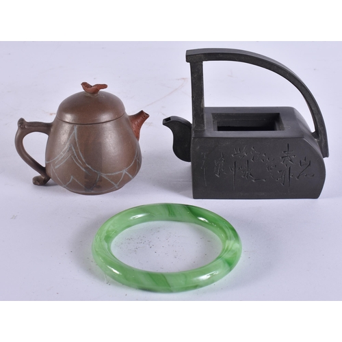 200F - TWO CHINESE YIXING POTTERY TEAPOTS AND COVERS together with a Peking glass bangle. (3)