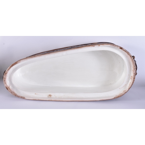 20G - A RARE LARGE 19TH CENTURY CONTINENTAL TREACLE GLAZED GAME TUREEN AND COVER formed with a large wild ... 