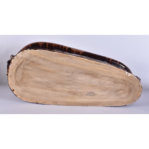 20G - A RARE LARGE 19TH CENTURY CONTINENTAL TREACLE GLAZED GAME TUREEN AND COVER formed with a large wild ... 