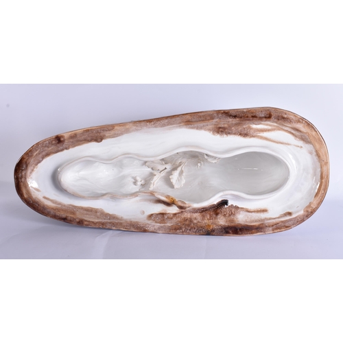 20G - A RARE LARGE 19TH CENTURY CONTINENTAL TREACLE GLAZED GAME TUREEN AND COVER formed with a large wild ... 